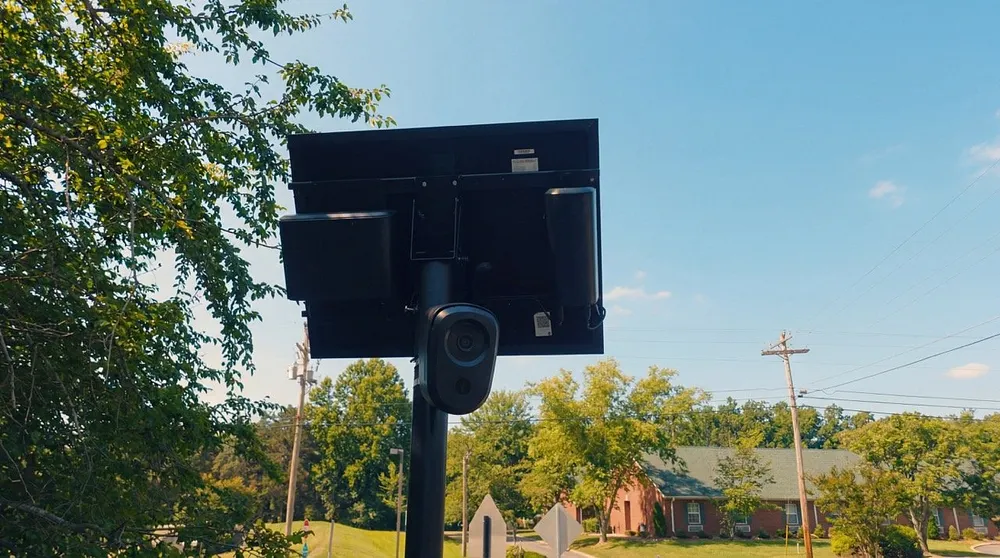 A Flock Safety license-plate camera on a pole with a solar panel, 2 December 2025.