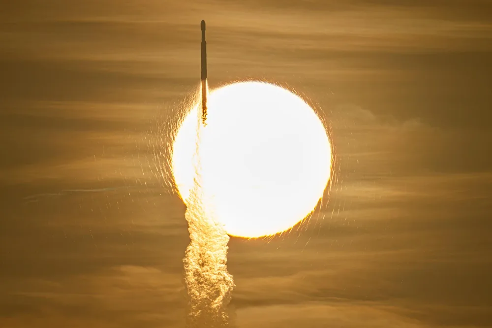 A SpaceX Falcon Heavy rocket with NASA's Nancy Grace Roman Space Telescope transits the sun during launch from Launch Complex 39A, Kennedy Space Center, Florida, 30 August 2026.