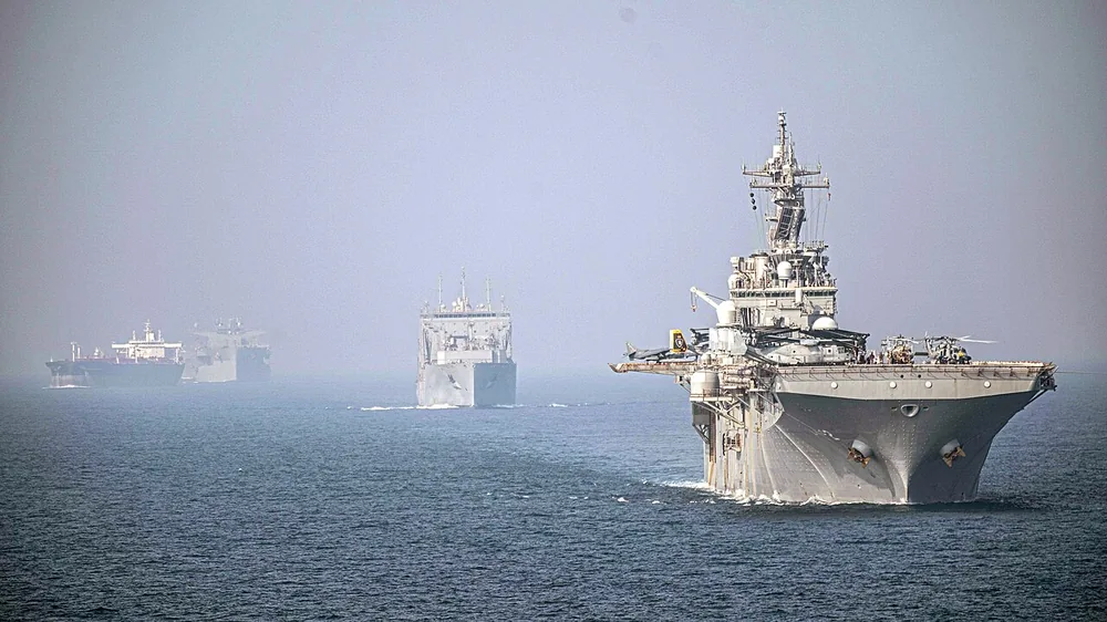 USS Essex (LHD 2) and USNS Wally Schirra (T-AKE 8) transit the Strait of Hormuz in formation, 17 September 2021.