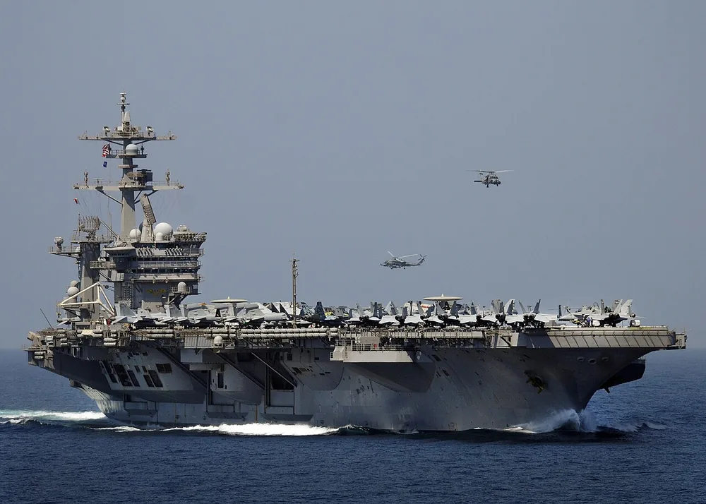 The Nimitz-class aircraft carrier USS Carl Vinson (CVN 70) transits the Strait of Hormuz on 10 March 2012.