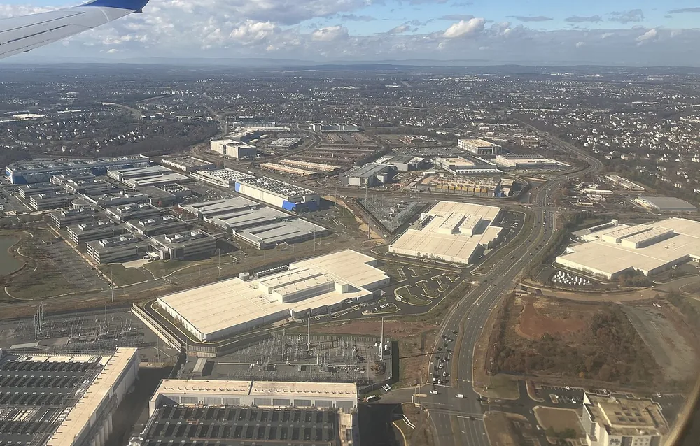 Aerial view of data centers among commercial buildings in Loudoun County near Ashburn, Virginia, 26 November 2025.