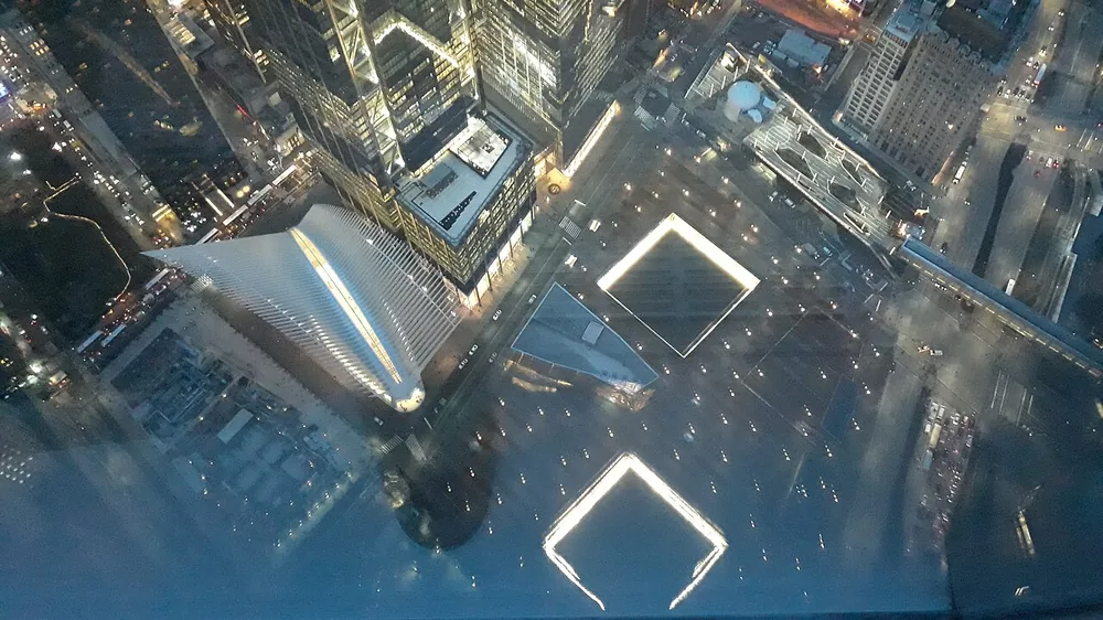 The National September 11 Memorial pools at night, seen from One World Trade Center in New York on 4 January 2019.