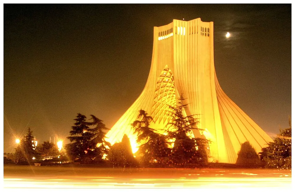 Azadi Tower illuminated at night in Tehran, Iran.