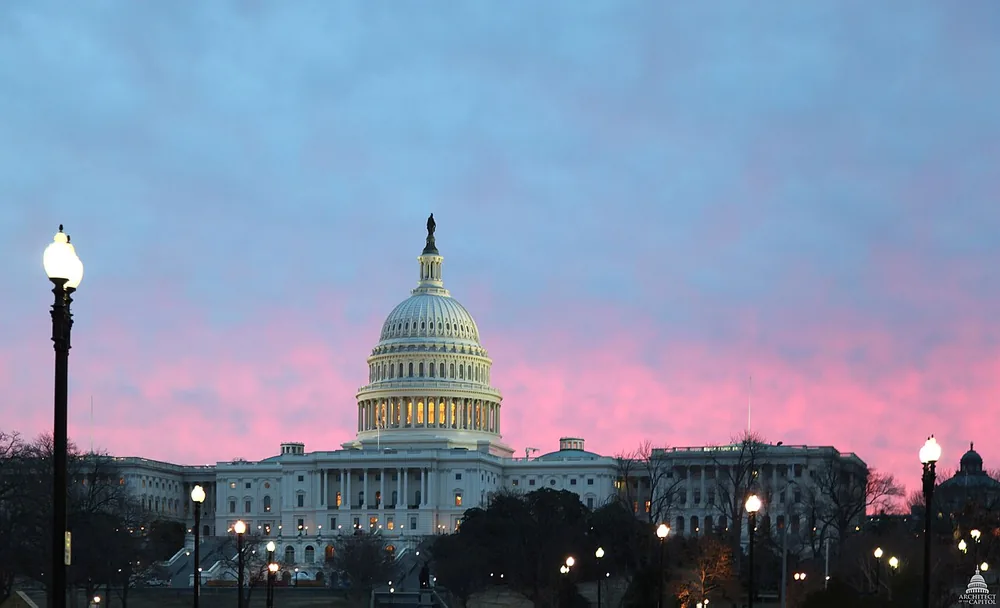 The west front of the United States Capitol at dawn in Washington, D.C.