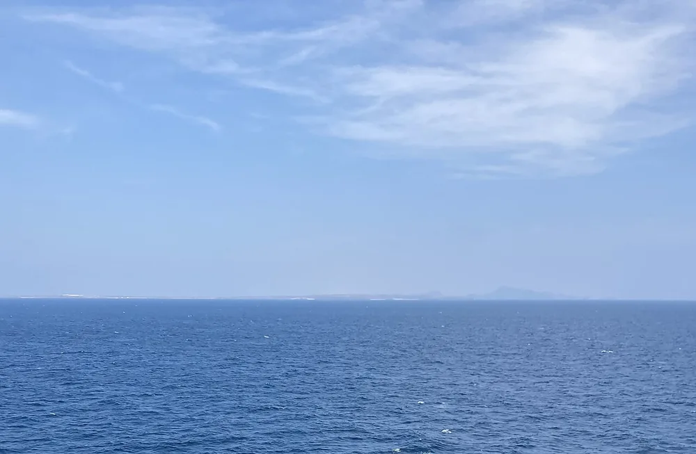 The Bab al-Mandeb Strait seen from mid-channel, with the Yemen coast in the distance.