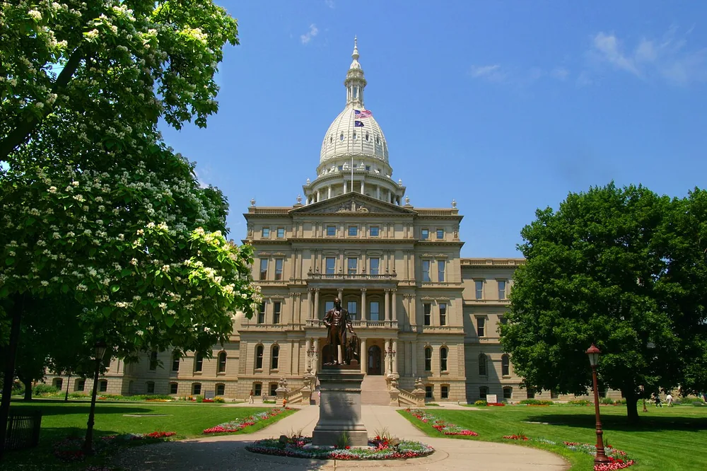 The Michigan State Capitol in Lansing with a catalpa tree in blossom, June 2006.
