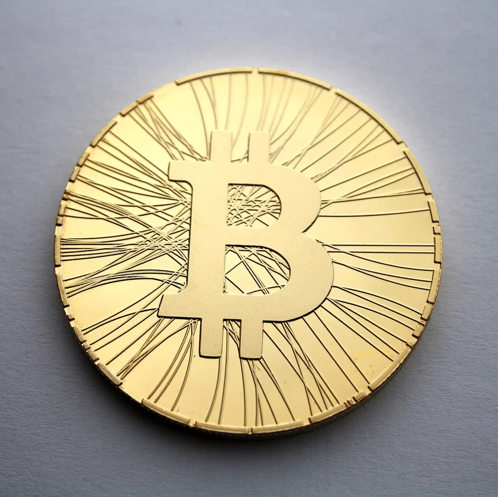 A physical bitcoin token, photographed in 2013.