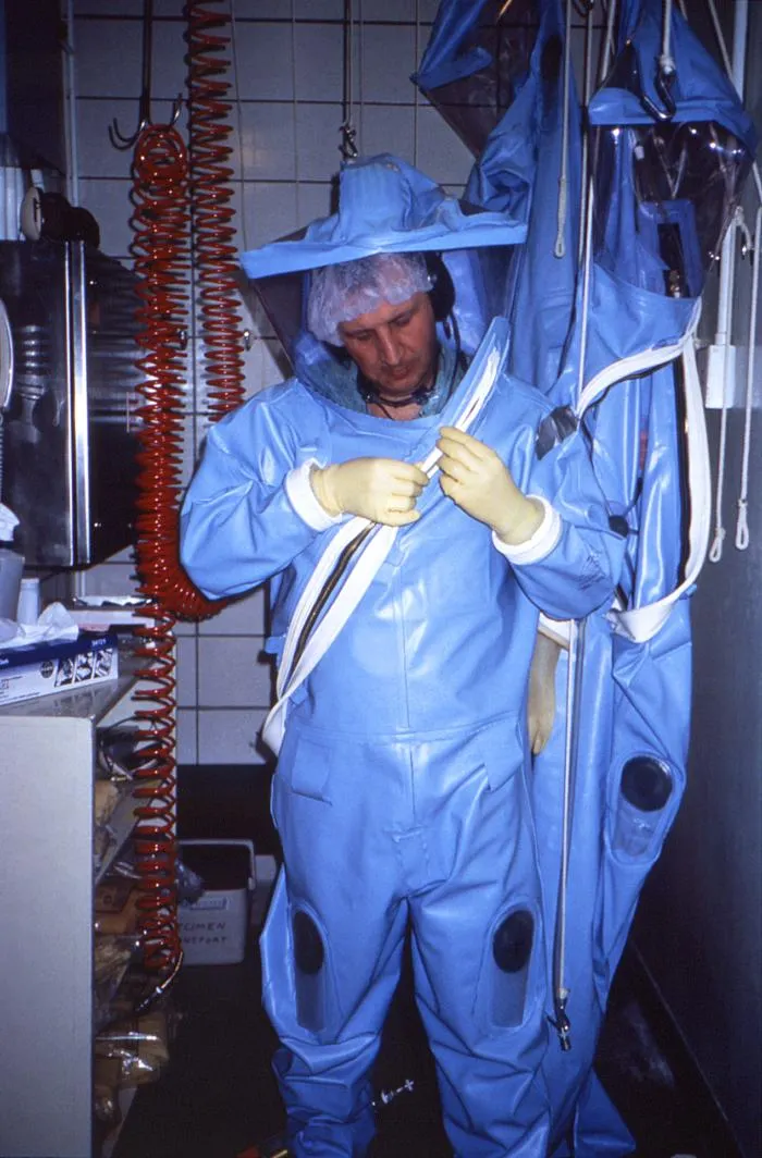 A researcher wearing a positive-pressure biosafety suit used in high-containment laboratories. Photo: U.S. Centers for Disease Control and Prevention, public domain.