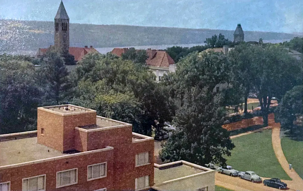 The Cornell University campus in Ithaca, with the clock tower beyond the trees. Photo: Curt Teich & Co. / Wikimedia Commons, public domain.