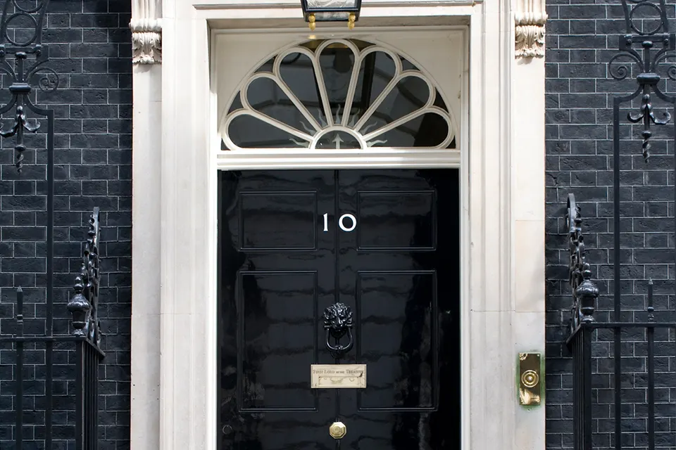 The door of 10 Downing Street in London. Photo: UK Government / Wikimedia Commons, OGL 3.