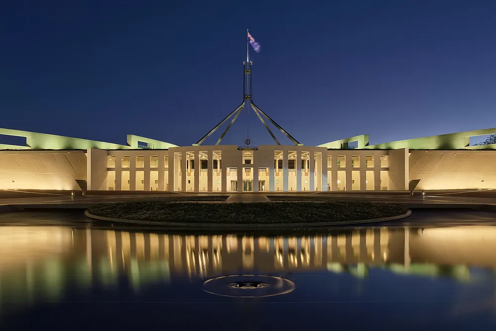 Parliament House in Canberra at dusk. Photo: Thennicke / Wikimedia Commons, CC BY-SA 4.0.